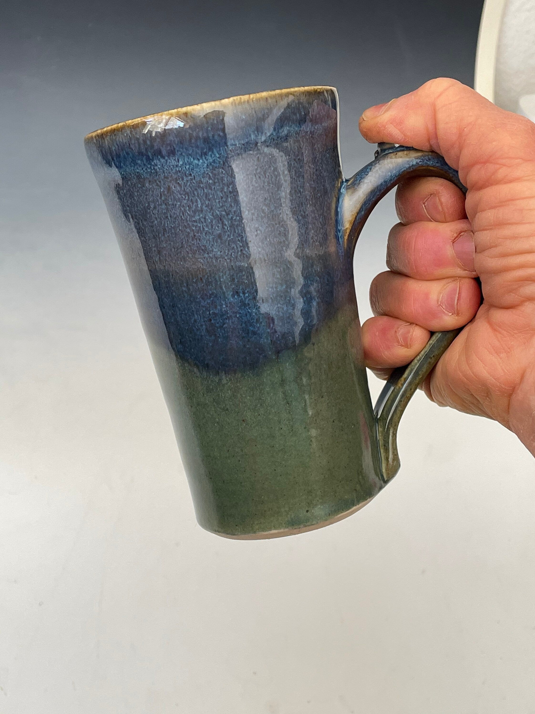 Blue pottery mug. Ceramic tea cup with thumb hold. Gift for Dad. Handmade pottery cup.